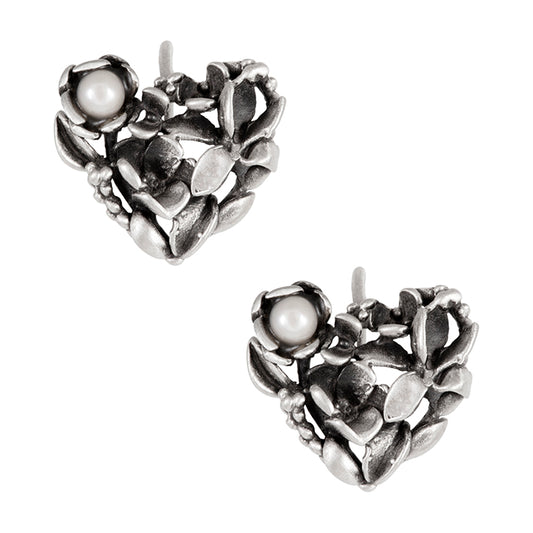 Diseño de autor par de aretes en plata 925 de corazón con flores. Aretes de joyería de autor mexicana en plata 925 ideales para eventos y celebraciones familiares, salidas con amigas. Aretes en plata 925 de Eva Carrillo Joyas.